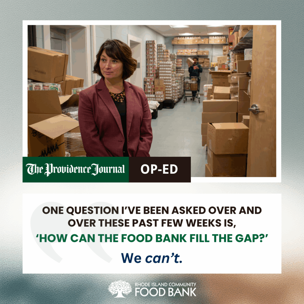 RI Food Bank CEO Melissa Cherney in a member agency's food storage room, looks at someone off-camera